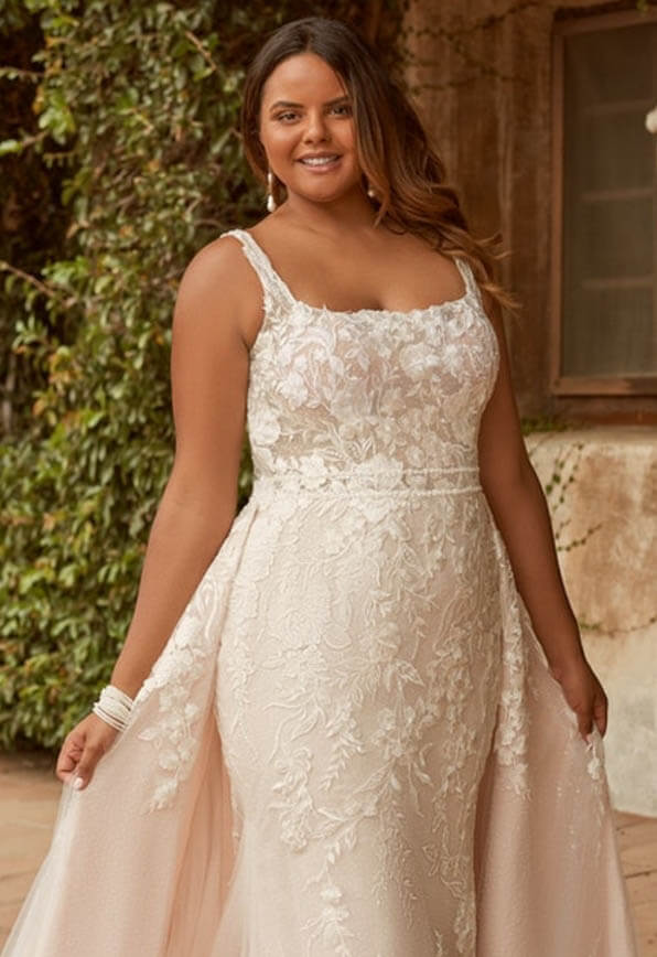 Model wearing a white gown by Maggie Sottero