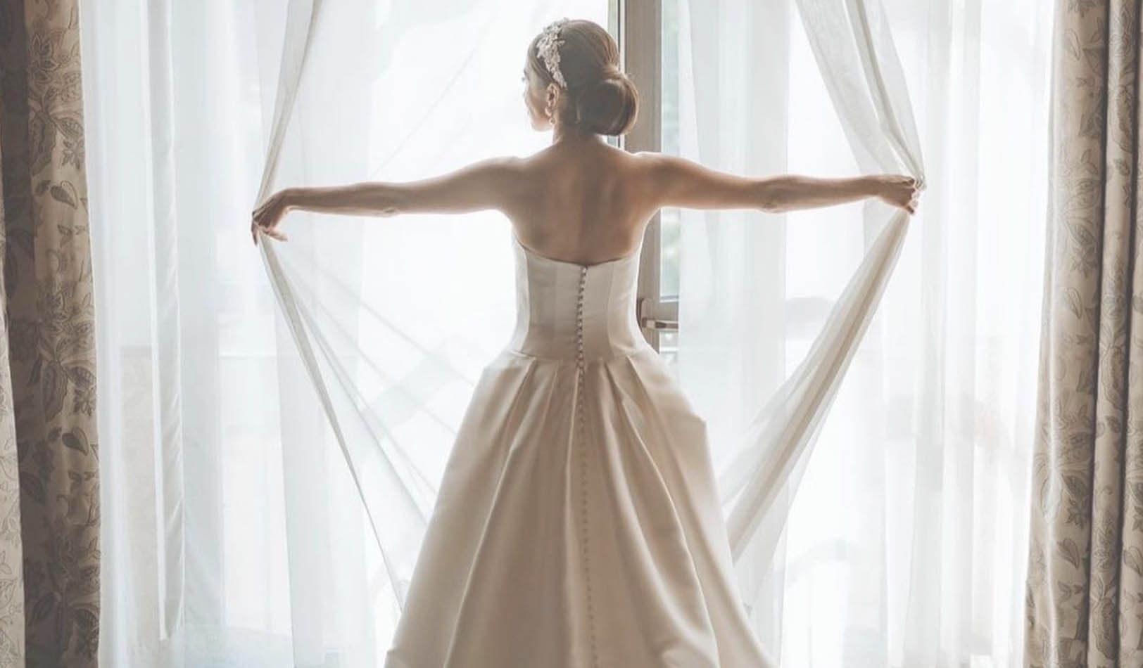 Model wearing a white gown