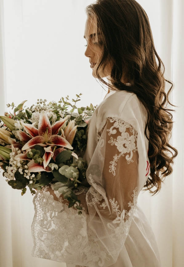 Model wearing a white gown