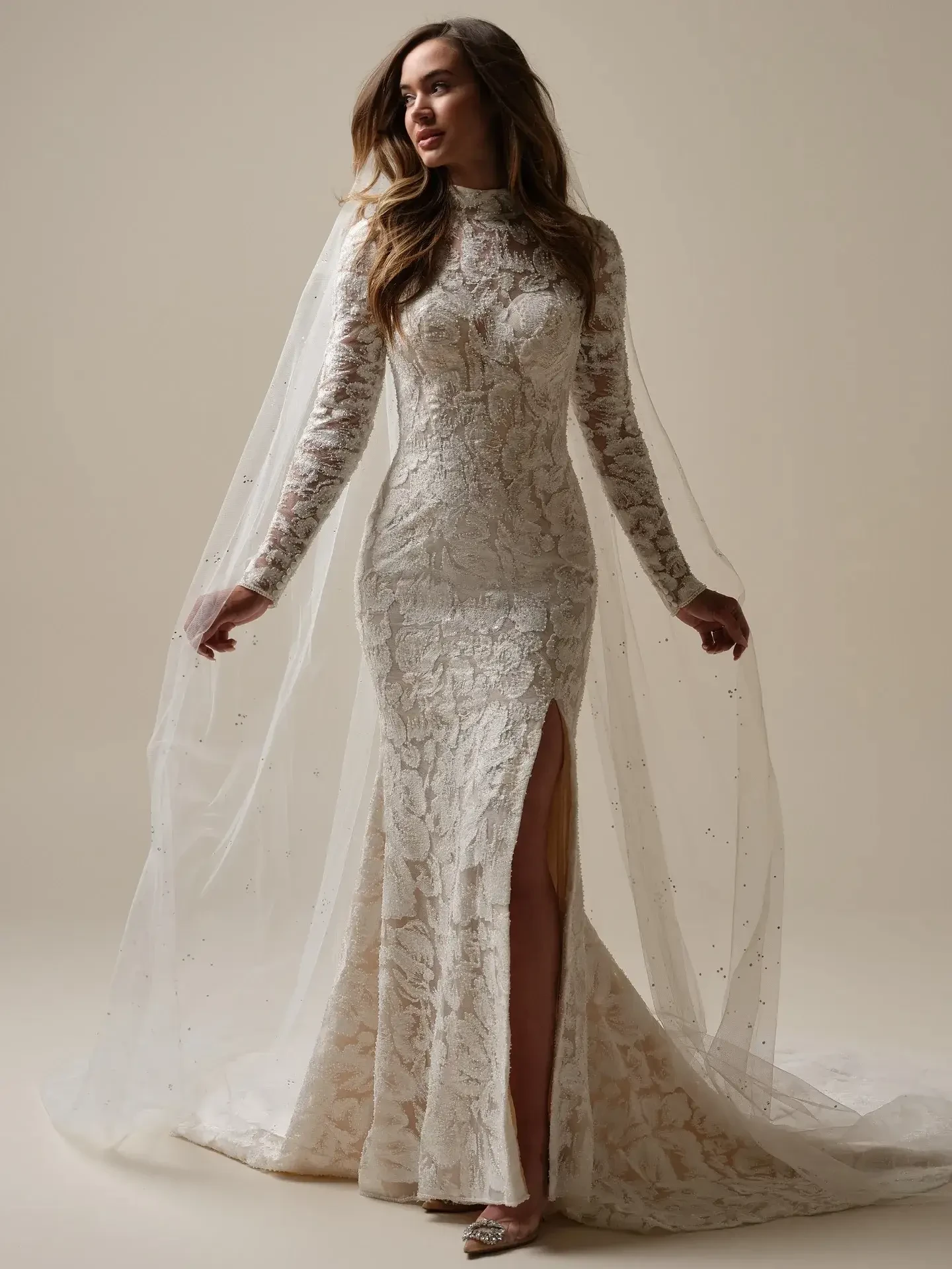 model is wearing a high neckline long sleeve lace wedding dress