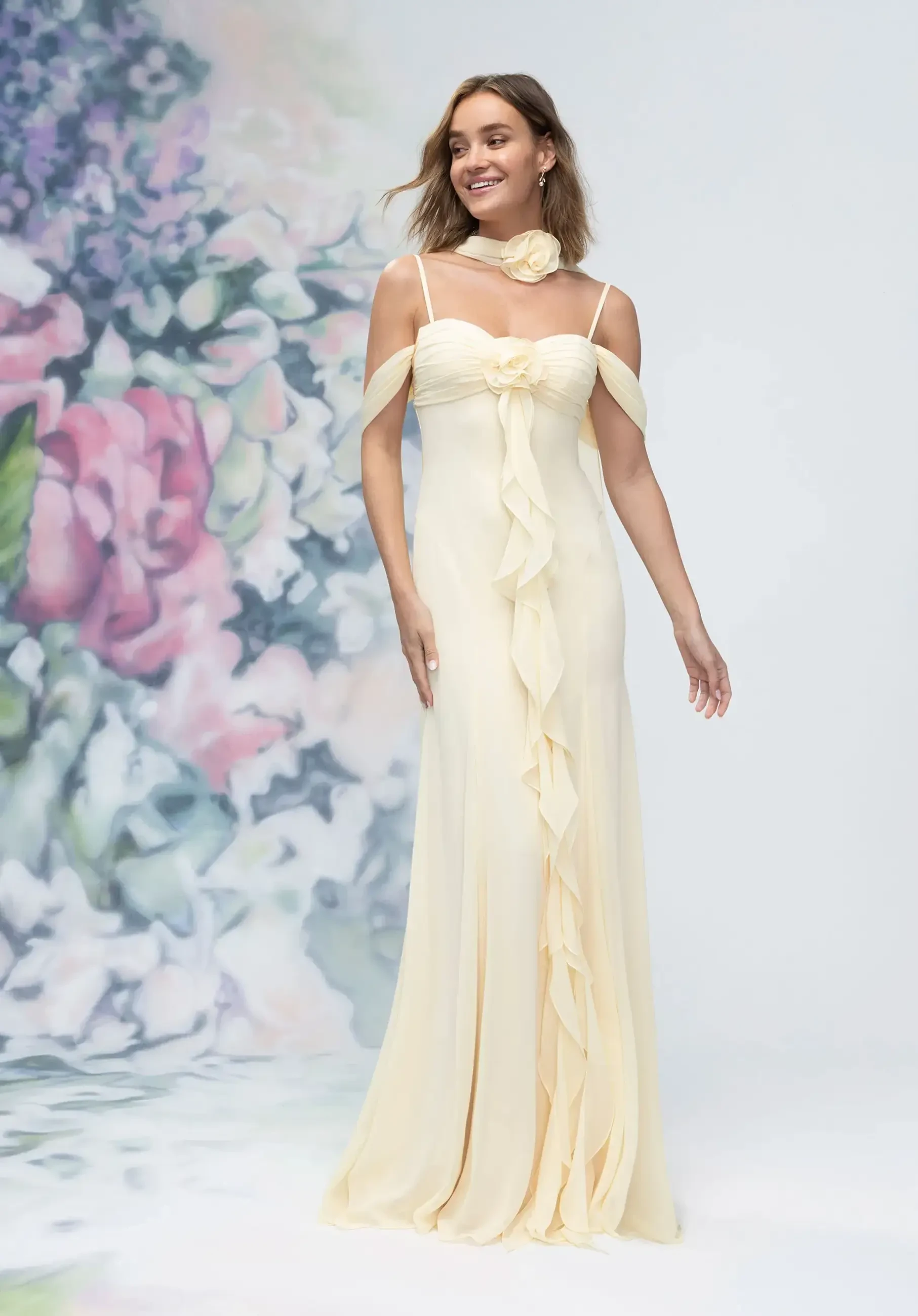 model is wearing a ruffled yellow bridesmaid dress