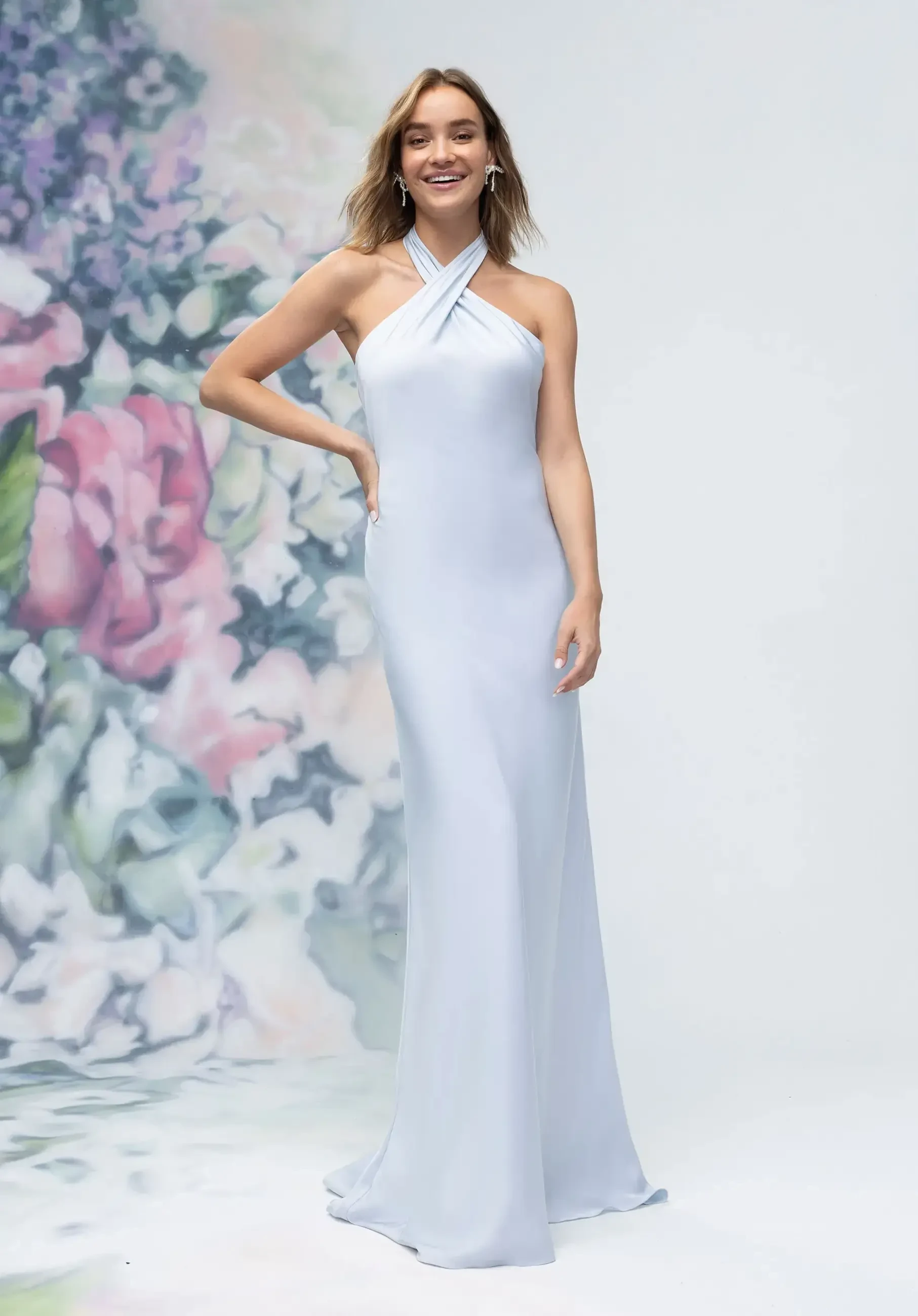 model is wearing a high neck light blue bridesmaid dress
