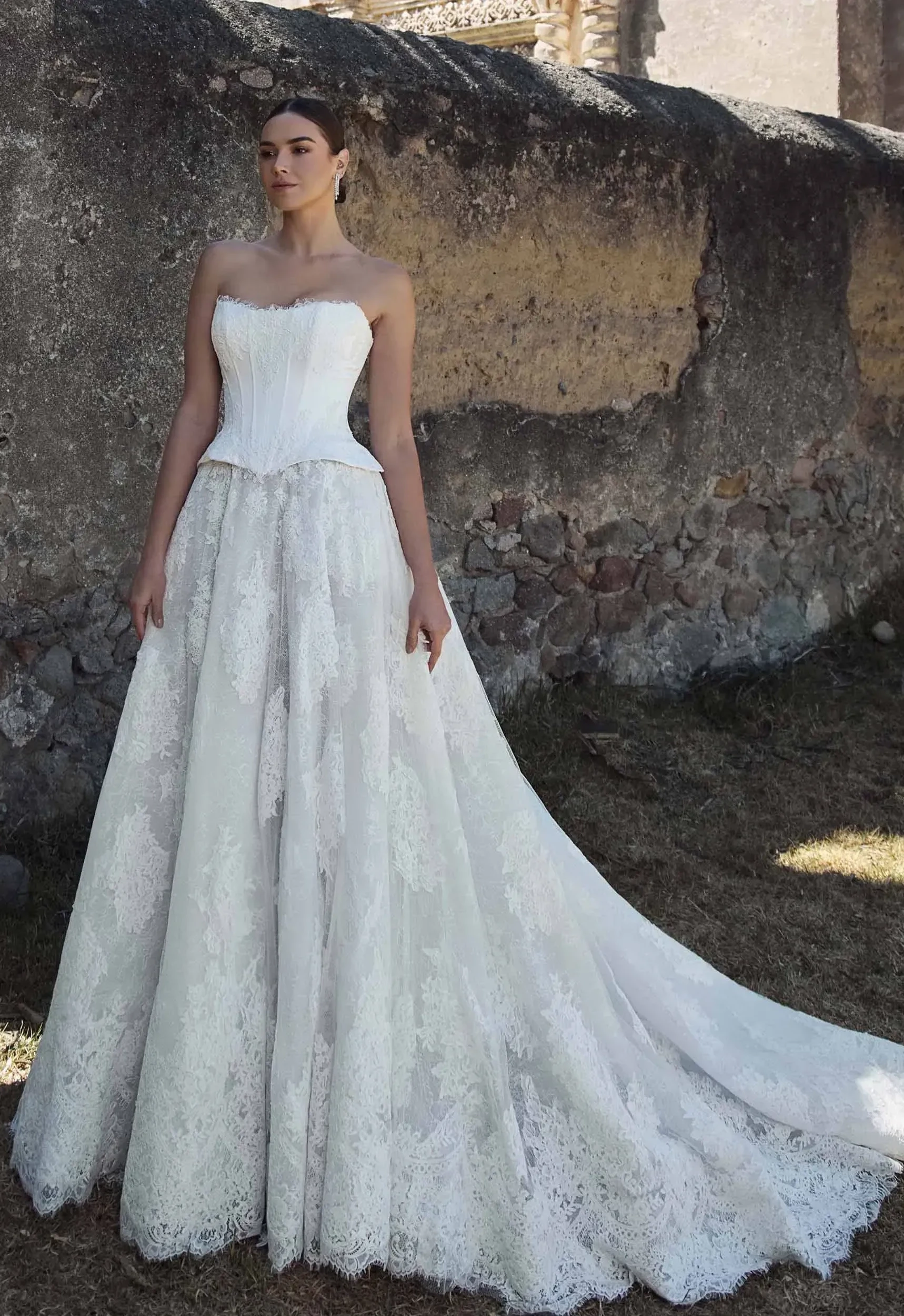 Model wearing a white gown by Calla Blanche