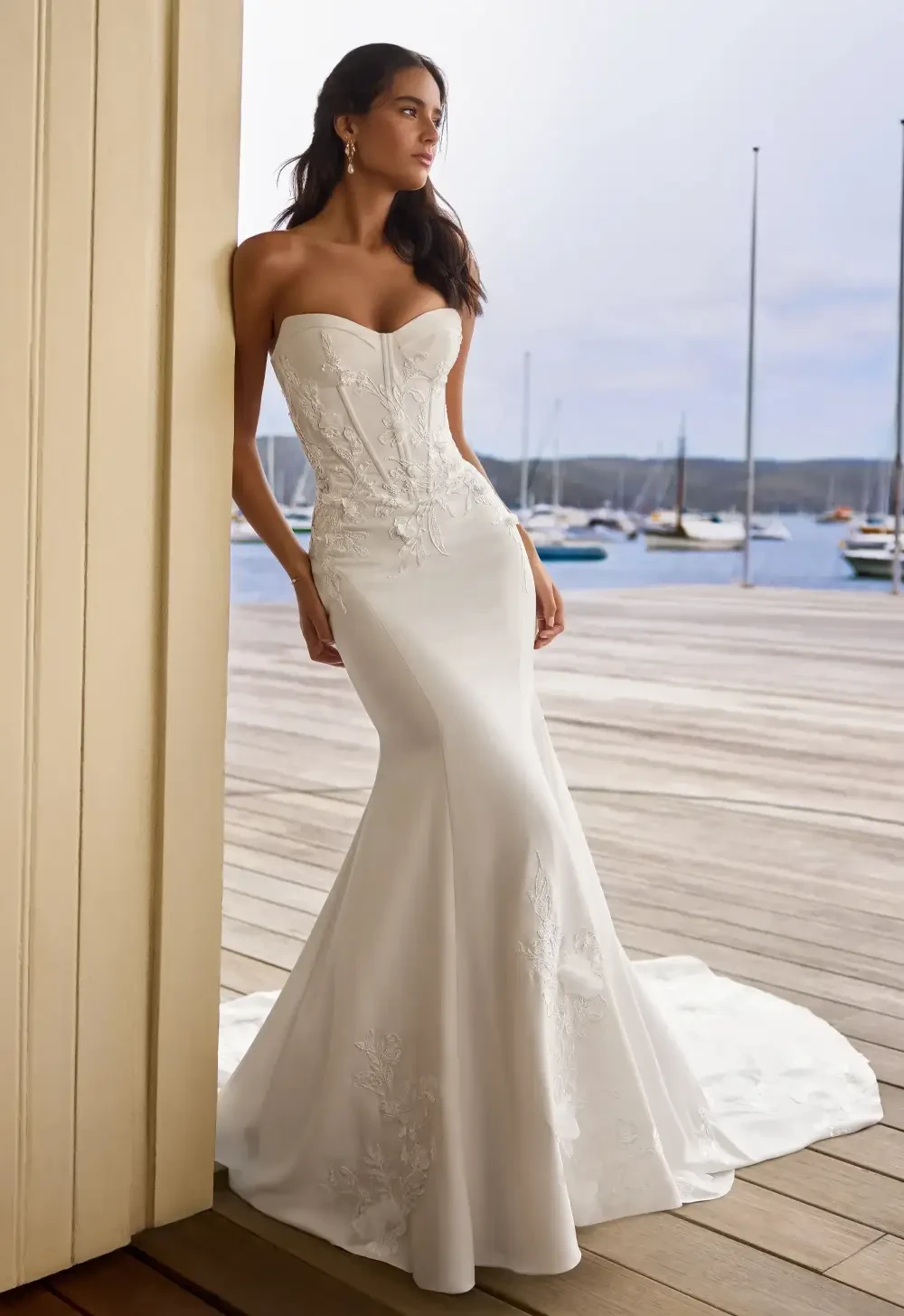 Model wearing a white gown by Allure Bridals