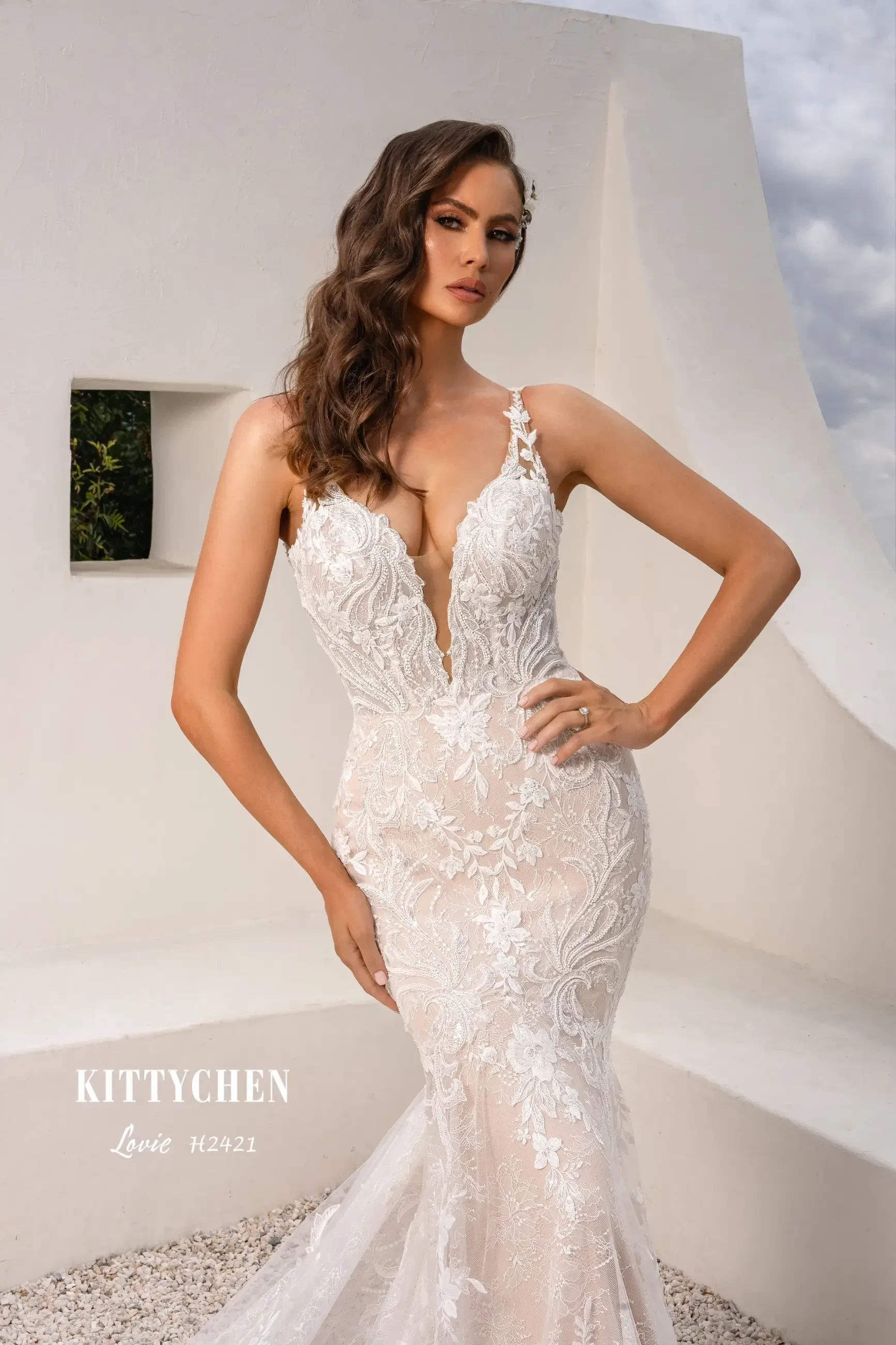 Fit for a Queen: Regal Bridal Gowns with Dramatic Trains &amp; Embellishments Image
